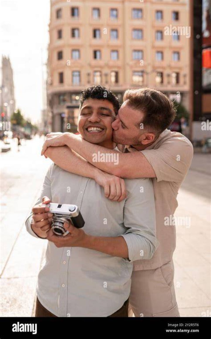 A man lovingly embracing his mother-in-law | Source: Shutterstock