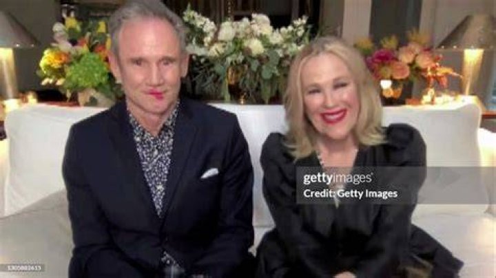 A screengrab of Bo Welch and Catherine O'Hara accepting the Best Actress in a Comedy Series Award at the 26th Annual Critics Choice Awards on March 7, 2021 | Source: Getty Images