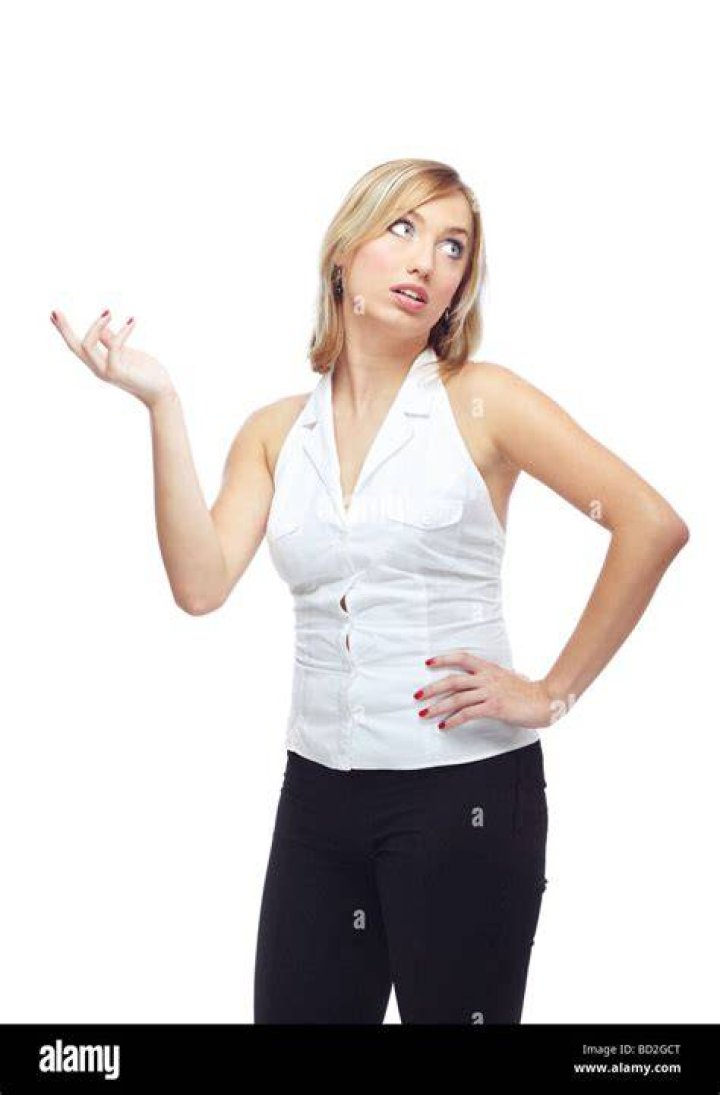 A woman gesturing to her mother-in-law while the older lady angrily raises her hand at her | Source: Shutterstock