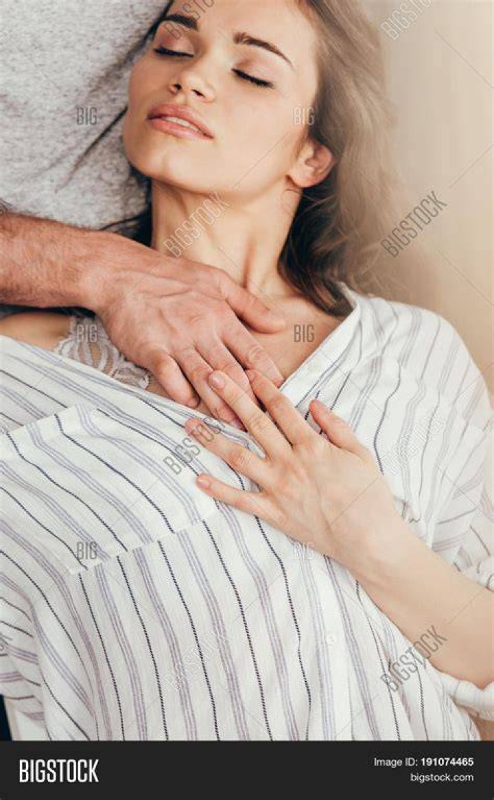 a woman touching the top of a radiator