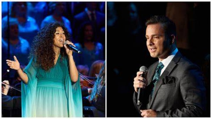 Adassa and Alex Melecio sing with the Tabernacle Choir with a colorful backdrop for the 2023 summer concert.