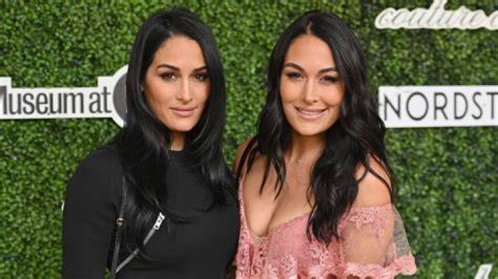 Are the Bella twins related to John Laurinaitis? Is Laurinaitis the Bella Twins father? ABTC