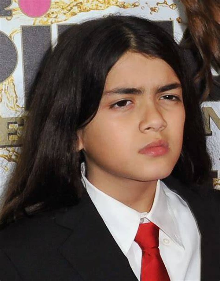 Blanket Jackson looks unrecognizable as he makes rare joint appearance with brother Prince