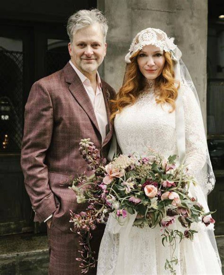 Christina stunned in a white lace bridal gown and veil 