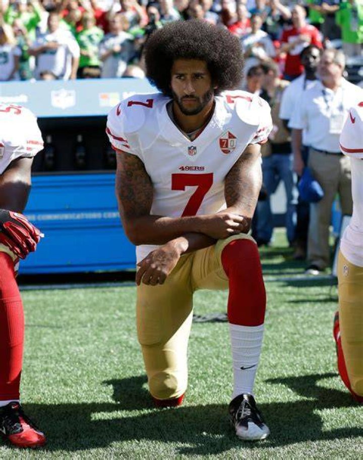 Colin Kaepernick pictured as he interacts with fans during the Michigan spring football game at Michigan Stadium in Ann Arbor | Source: Getty Images