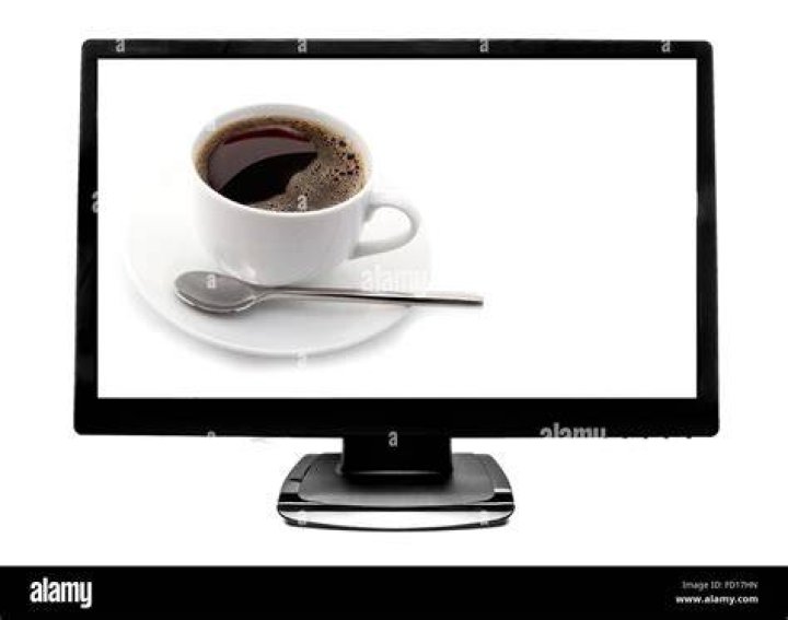 Cup near flat screen television turned onto Netflix | Photo: Pexels