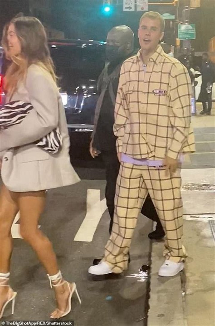 Dressed down: Justin opted for a casual beige plaid ensemble with peeks of a purple shirt peering out from underneath his button-down