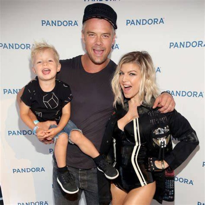 Fergie, Axl Jack Duhamel, and Josh Duhamel at the baseball game between the Boston Red Sox and Los Angeles Dodgers on August 7, 2016 | Source: Getty Images