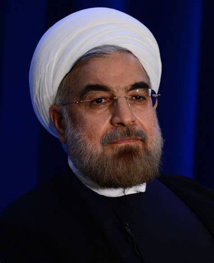 Former President Hassan Rouhani, second right, listens to head of the Atomic Energy Organization of Iran Ali Akbar Salehi while visiting an exhibition of Iran's new nuclear achievements in Tehran, Iran, in April 2021.