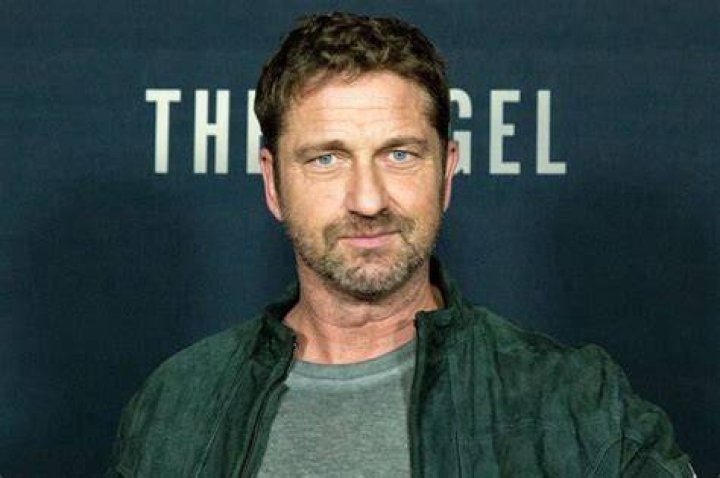 Gerard Butler unrecognizable as he smokes cigarette shirtless on balcony Celebrity News