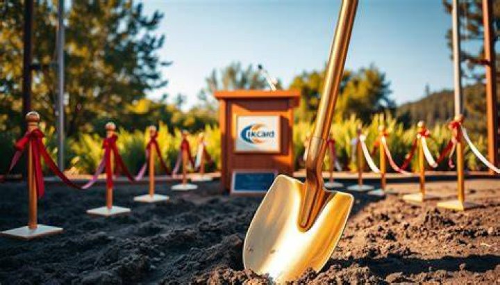 Groundbreaking ceremony for the Vernal Utah Temple. President Gordon B. Hinckley at the pulpit speaking and shovels lined up next to each other against the stage.