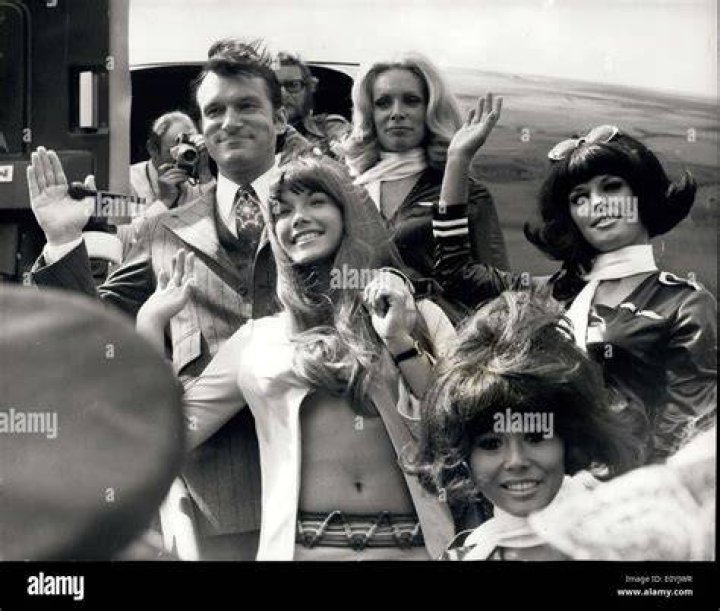 Hugh Hefner arrives at Heathrow Airport on his private jet the 'Big Bunny' with 'Jet Bunnies' who were met at the airport by British Bunnies in 1970. Hefner is pictured with his girlfriend Barbi Benton (right)