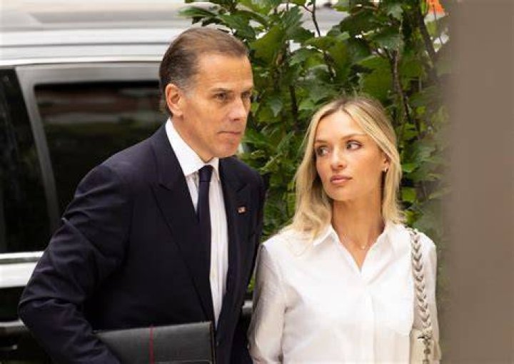 Hunter Biden and his wife Melissa Cohen are photographed in New York today visiting Beyonce and Jay-Z's building with a heavy detail of security.