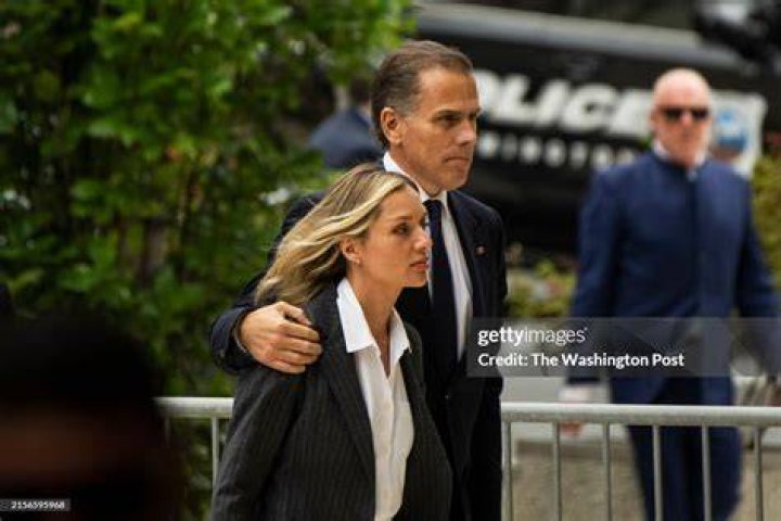 Hunter Biden arrives with his wife and child with gallery owner George Berges for the opening night of his painting show at George Berges Gallery in Manhattan on Nov. 10, 2021.