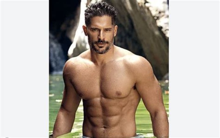 Joe Manganiello in a black suit and Sofi&shy;a Vergara in a white strapless dress