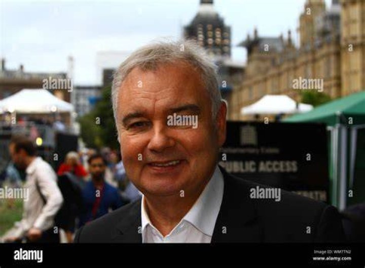 Journalist and broadcaster, Eamonn Holmes, (2R), with his wife Ruth Langsford (2L), his son Jack (L) and daughter Rebecca, poses with his medal after he was appointed Officer of the Order of the British Empire (OBE) for services to broadcasting, by Britain's Queen Elizabeth II during an investiture ceremony at Buckingham Palace in London on June 1, 2018