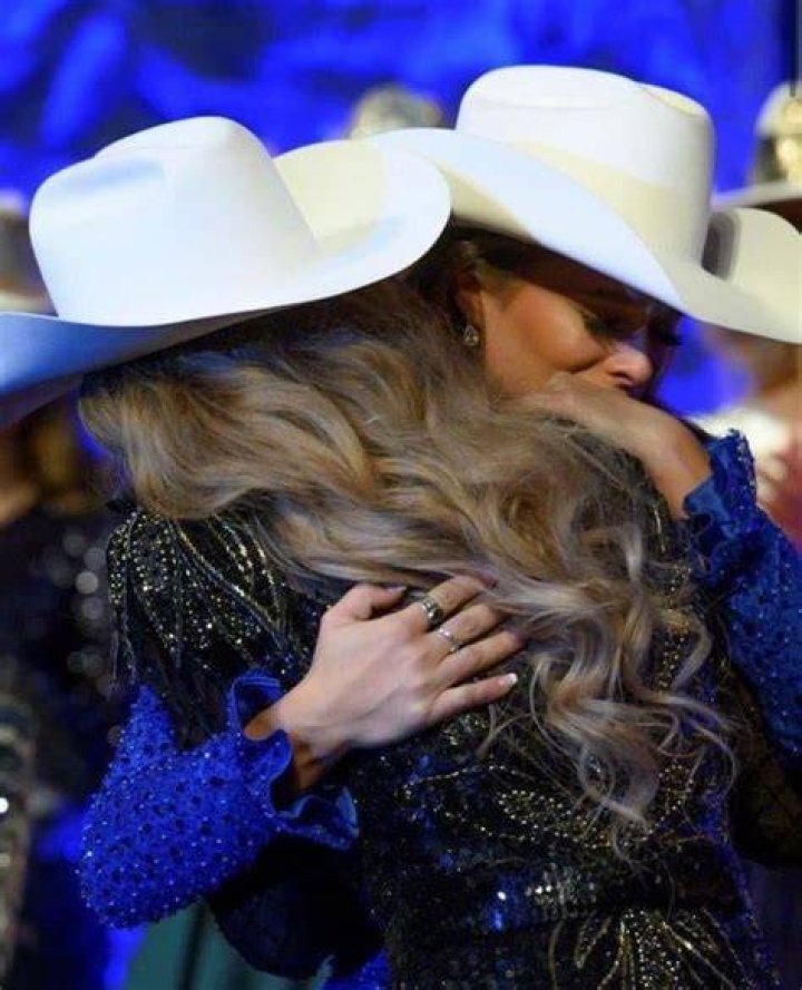 Kennadee Riggs shares a hug with her friend, Adrianne Schaunaman, Miss Rodeo South Dakota, after hearing Riggs&rsquo; name announced as Miss Rodeo America.