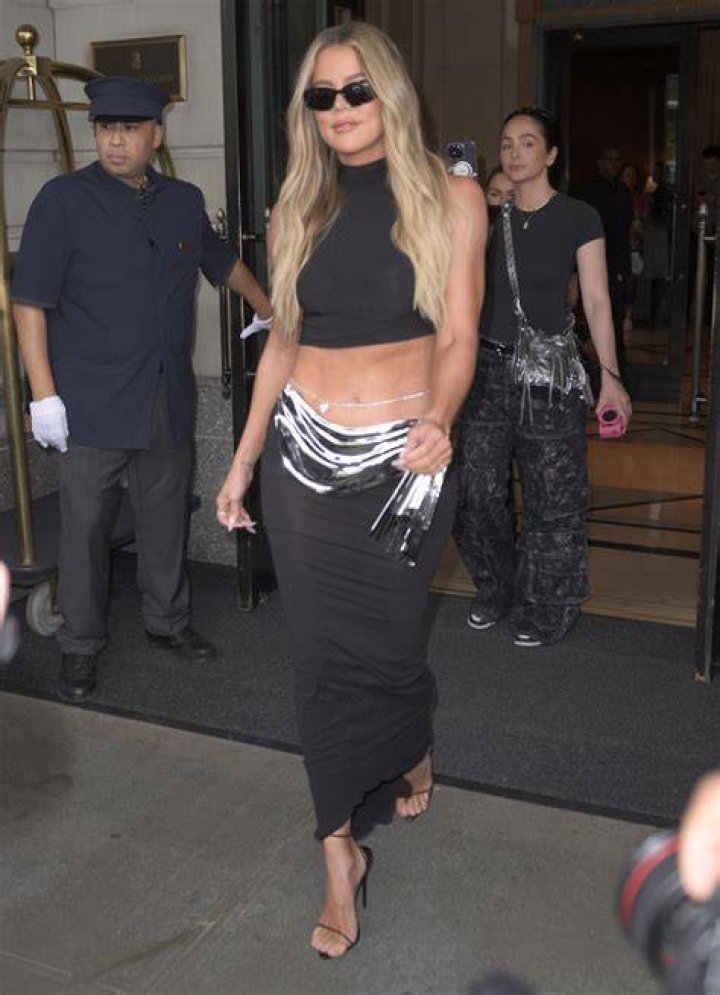 Khloe wore a black tank top and matching tights as she held her only child in her arms