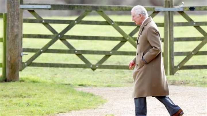 king charles walking past guard of honour in kenya 