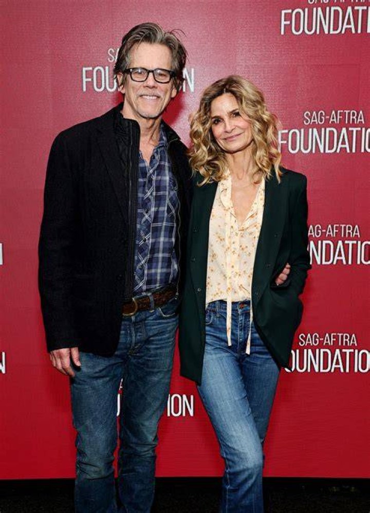 Kyra Sedgwick holding up a piece of paper
