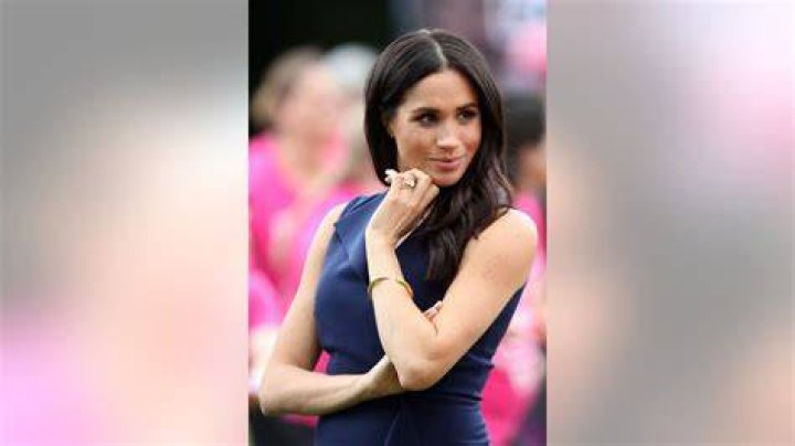 Meghan Markle showing off her wedding and engagement rings on her 2018 wedding day