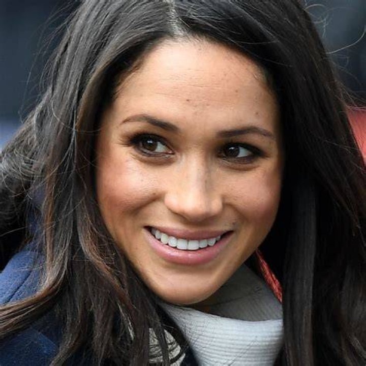 Meghan Markle smiles at her friend during the Katy Perry concert