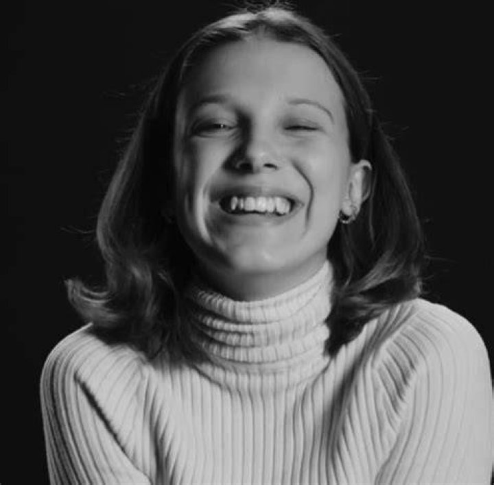 millie bobby brown smiling on stage