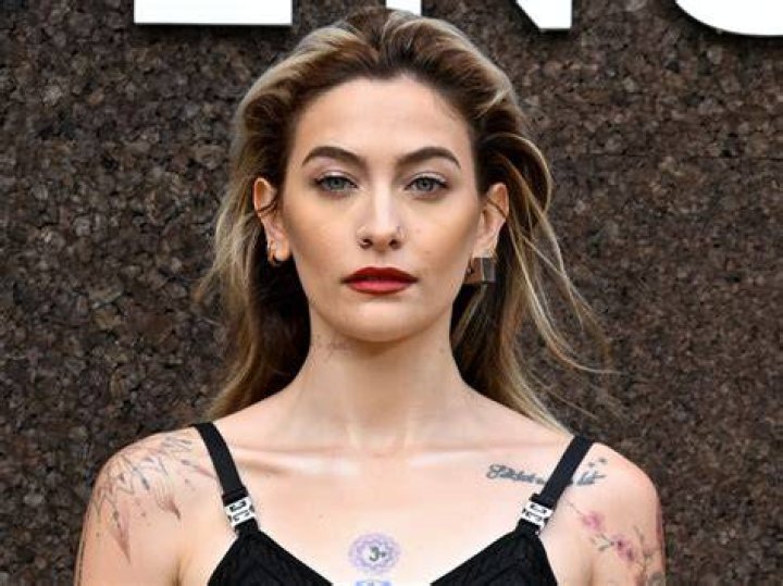 Paris Jackson singing into a mic on stage