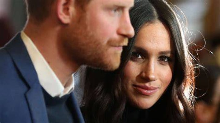 Prince Harry and Meghan Markle have been criticised for taking a private jet to a gig. Pictured: Meghan Markle stands at the Katy Perry show on Saturday