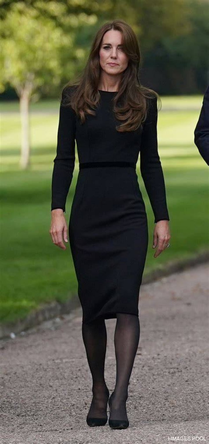 Princess Kate wearing black and white polka dots and a hat