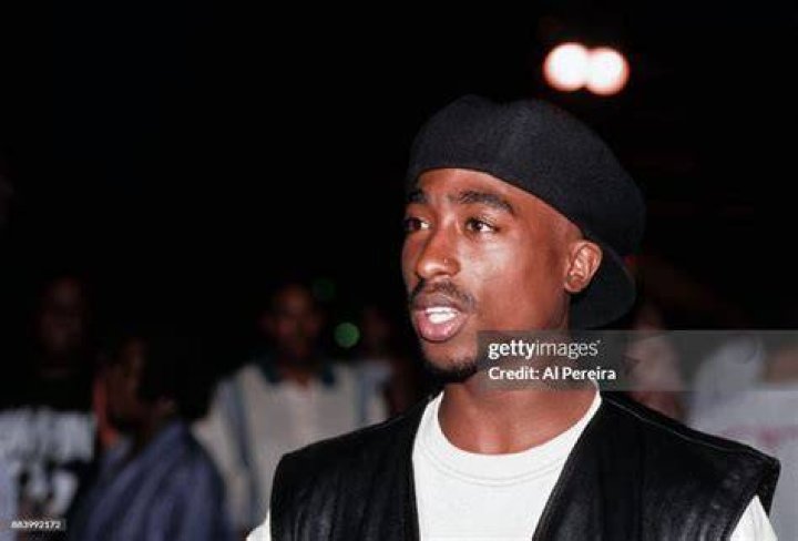 Rapper Tupac Shakur poses for photos backstage after his performance at the Regal Theater in Chicago, Illinois in March 1994