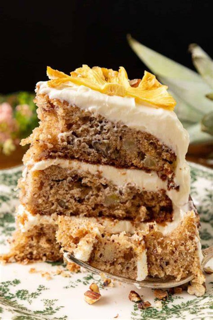 slice of hummingbird cake with cream cheese frosting