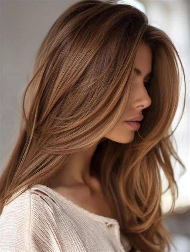 Stylish: Her light brown hair was styled in loose waves as she smiled next to her friend, J.Ryan La Cour, who wore a white t-shirt and $35 black ripped jeans from Boohoo