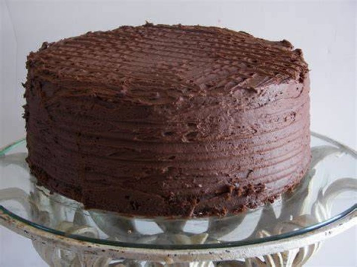 whole chocolate cake garnished with mint leaves