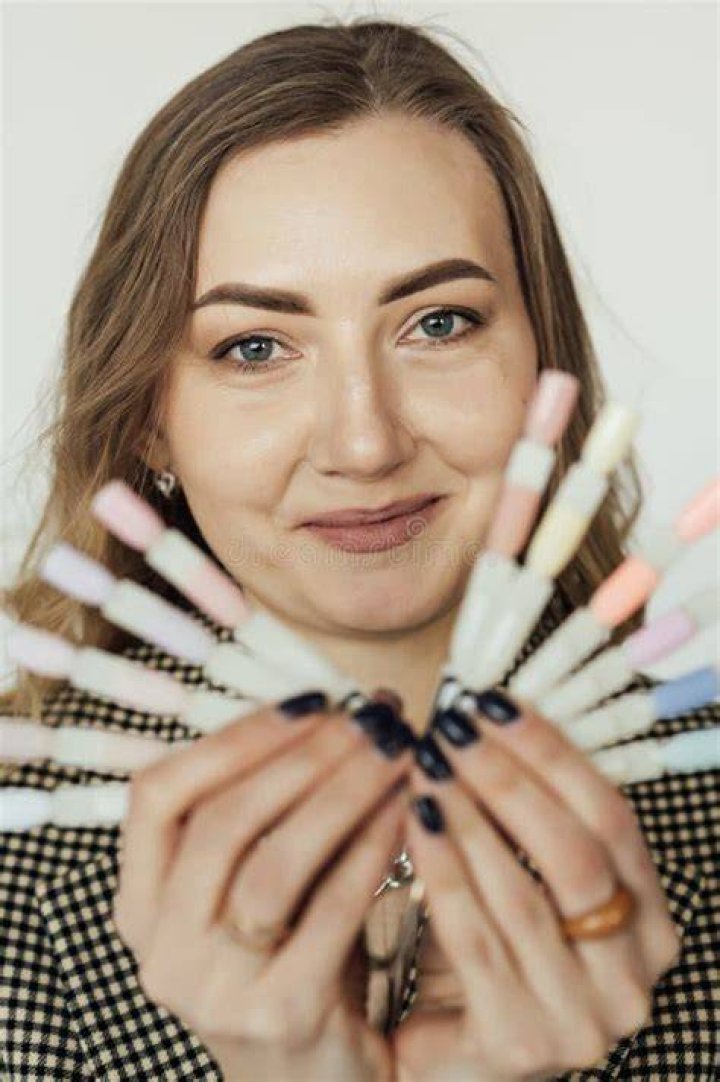 woman posing with shimmery nails