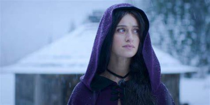 Yennefer wearing a purple cloak in The Witcher season three. 